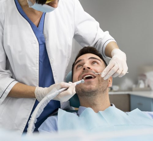 dentist-doing-check-up-patient-scaled.jpg